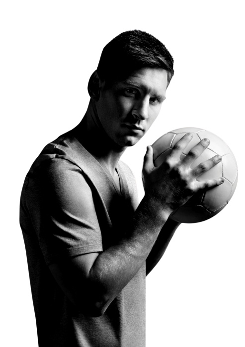 Lionel Messi is standing by, holding a football on hand