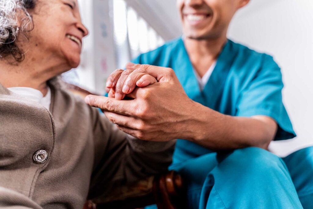 A nurse helping an elderly woman at a hospital